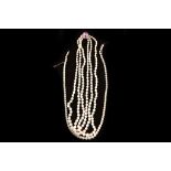 A graduated cultured pearl three row necklace to an antique collet set amethyst and gold single