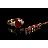 An 18 carat yellow gold, diamond, and ruby ring, set oval cut ruby of approx. 20. carats, flanked by