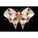 A mother-of-pearl, sapphire, ruby and diamond butterfly brooch The mother-of-pearl wings accented by