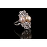 A pearl and diamond dress ring, circa 1920 The pair of 7.5mm pearls, to finely pierced rectangular