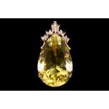 A 9 carat yellow gold, lima quartz and diamond pendant, having large pear cut quartz of approx. 35