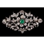 An emerald and diamond brooch, circa 1880 The openwork spray of cushion-shaped, with rose-cut