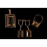 A smoky quartz suite The pendant, earrings and ring all set with step-cut smoky quartz (3) Total