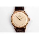GENTS VINTAGE OMEGA. A gents c.1940's 18ct rose gold cased Omega automatic dress watch, the cream