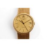 BAUME & MERCIER DRESS WATCH. A c.1980's 18ct gold Baume & Mercier dress watch, with gilt weave