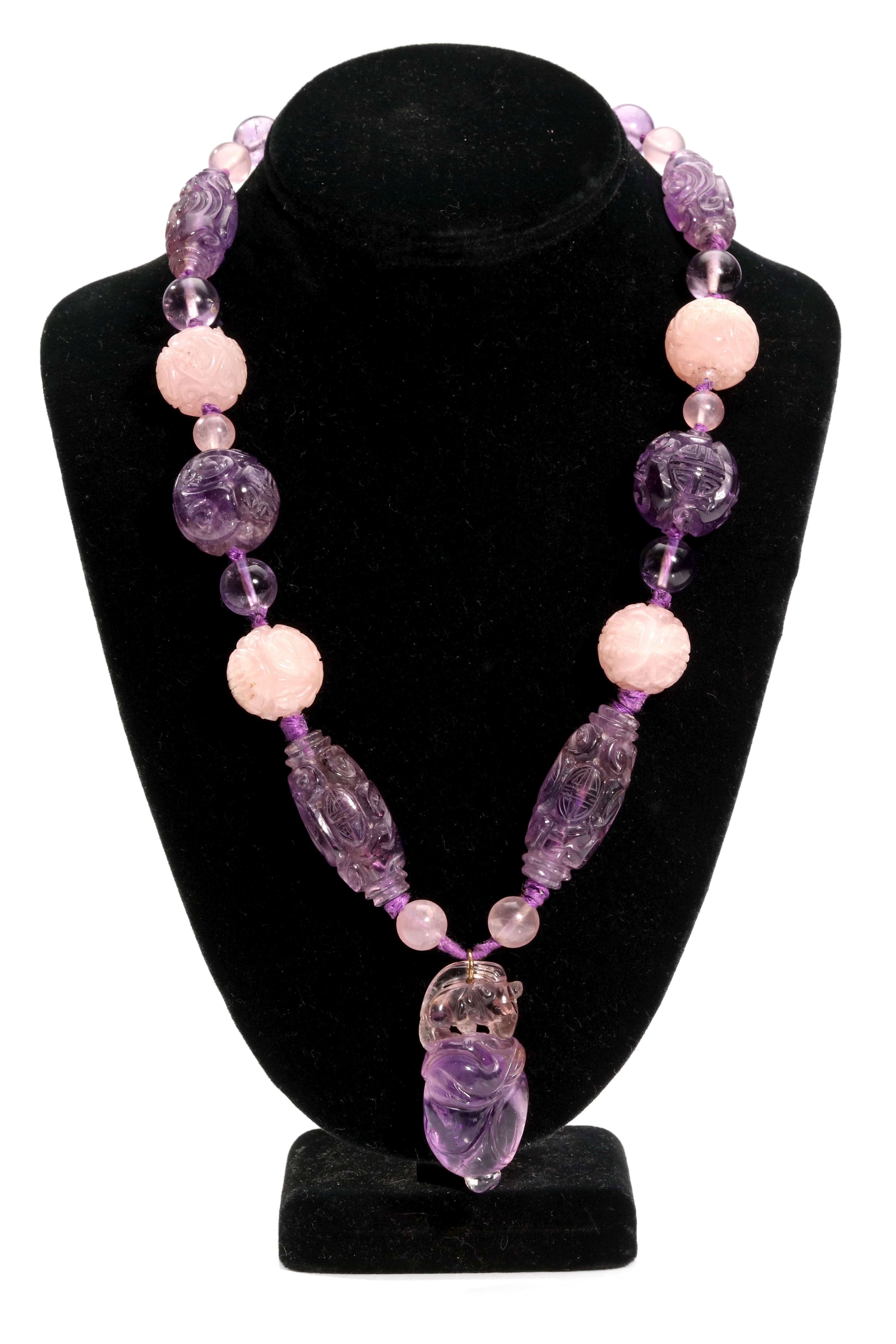 A rose quartz and amethyst necklace Set with polished and carved beads featuring Chinese - Image 2 of 4