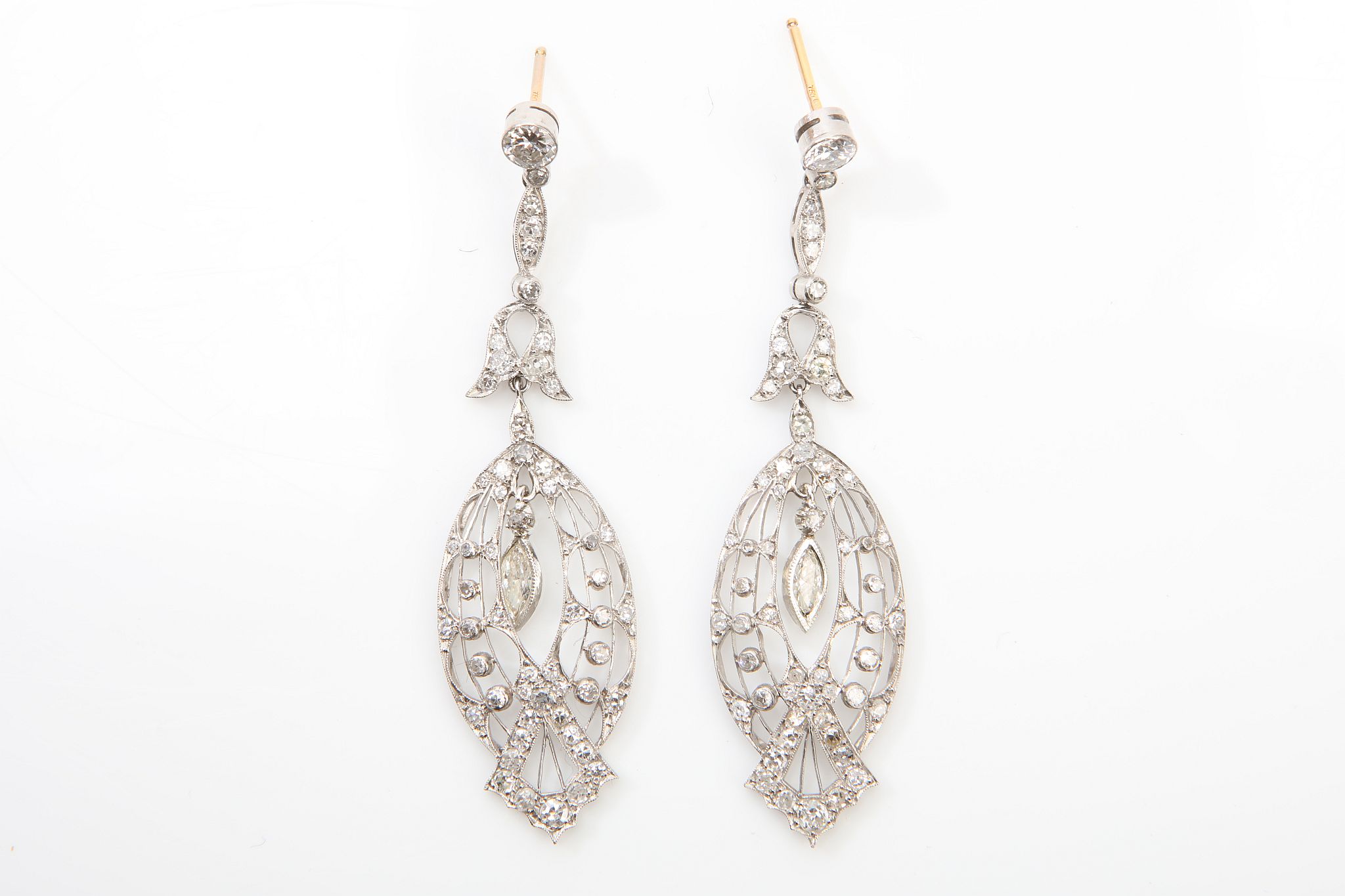 A pair of diamond pendent earrings Of pierced design, set throughout with single-cut diamonds,