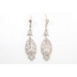 A pair of diamond pendent earrings Of pierced design, set throughout with single-cut diamonds,