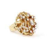A diamond dress ring, circa 1970 Of naturalistic form, set to the centre with a marquise-cut
