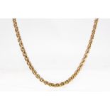 A gold necklace The 18 carat yellow gold fancy-link chain, partial UK hallmark, European