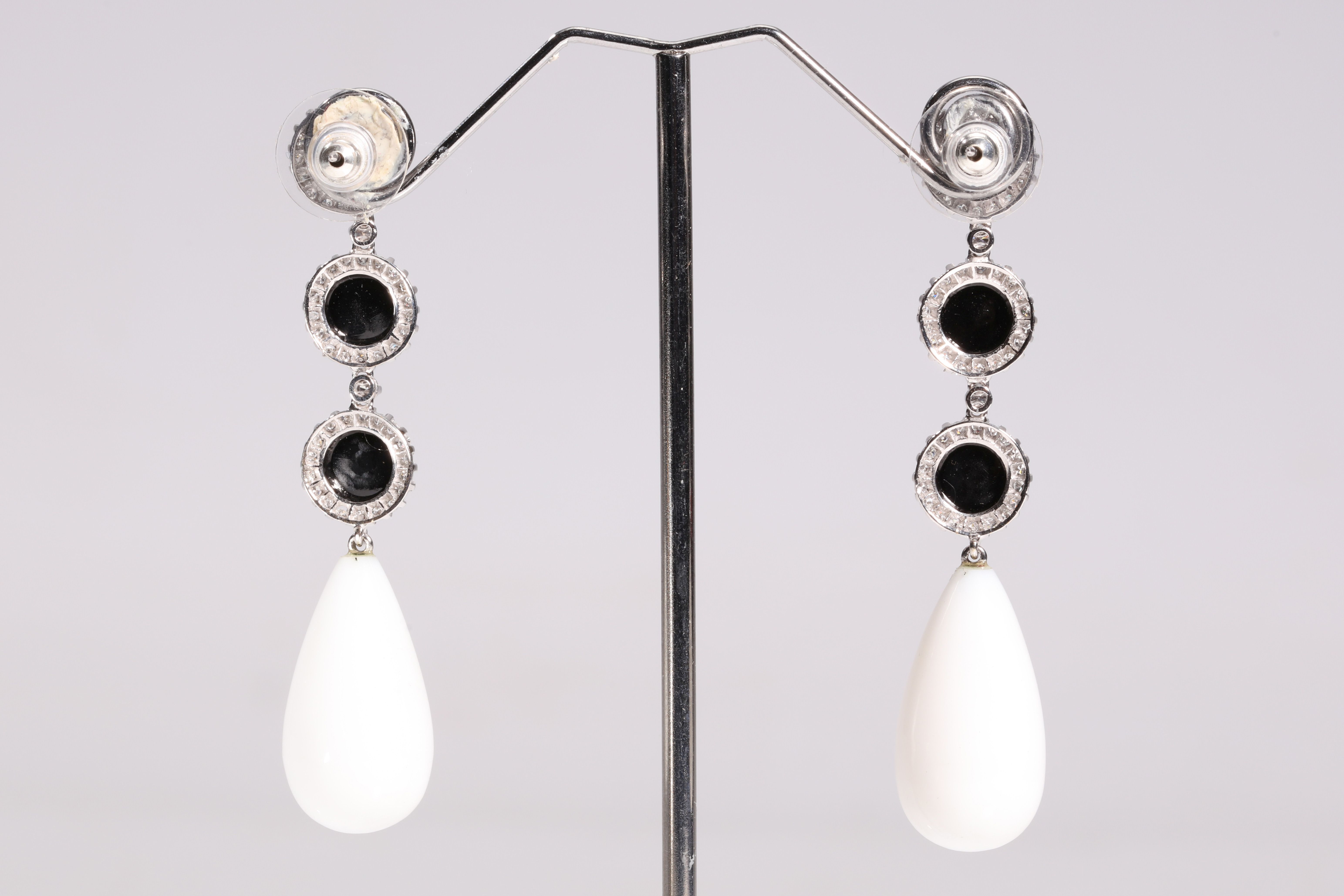 A pair of onyx, white chalcedony and diamond pendent earrings The graduated trio of circular - Image 2 of 2