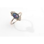 An opal doublet and diamond dress ring, circa 1920 The collet-set oval opal doublet, with old