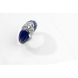 A lapis lazuli and diamond ring The reeded lapis lazuli centrally set with a brilliant-cut diamond