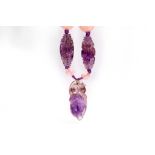 A rose quartz and amethyst necklace Set with polished and carved beads featuring Chinese