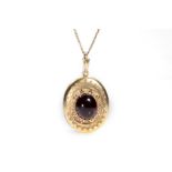 A late 19th century paste locket pendant The large oval locket applied with granulation detail and