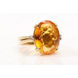 A citrine and diamond dress ring, by H. Stern The oval-cut citrine, in a four-claw setting, the