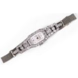 A diamond wristwatch The rectangular dial with Arabic and dot hourmarkers, the bezel and lugs set
