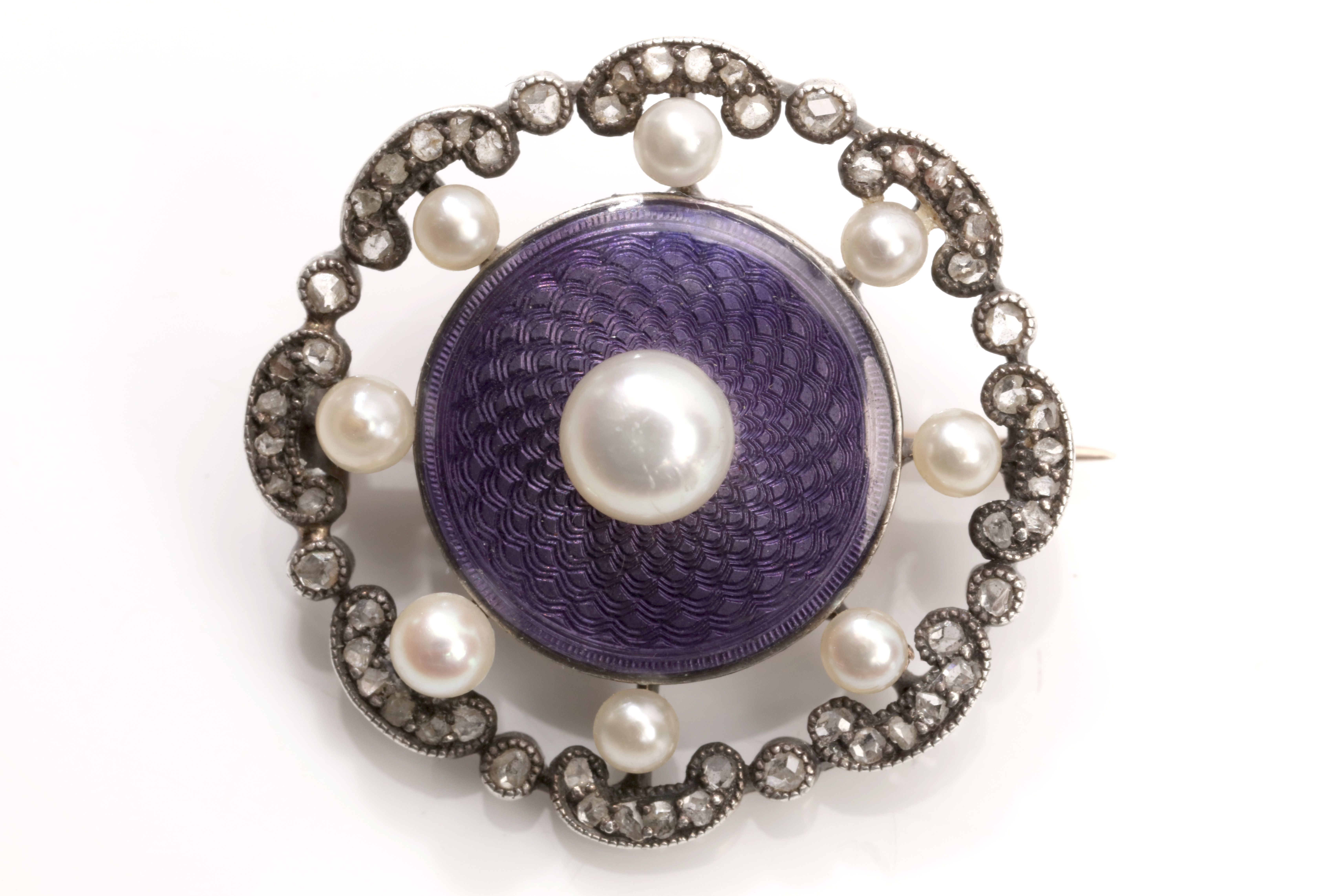 A pearl, enamel and diamond brooch, circa 1905 The purple guilloché enamel disc set with a 5.5mm