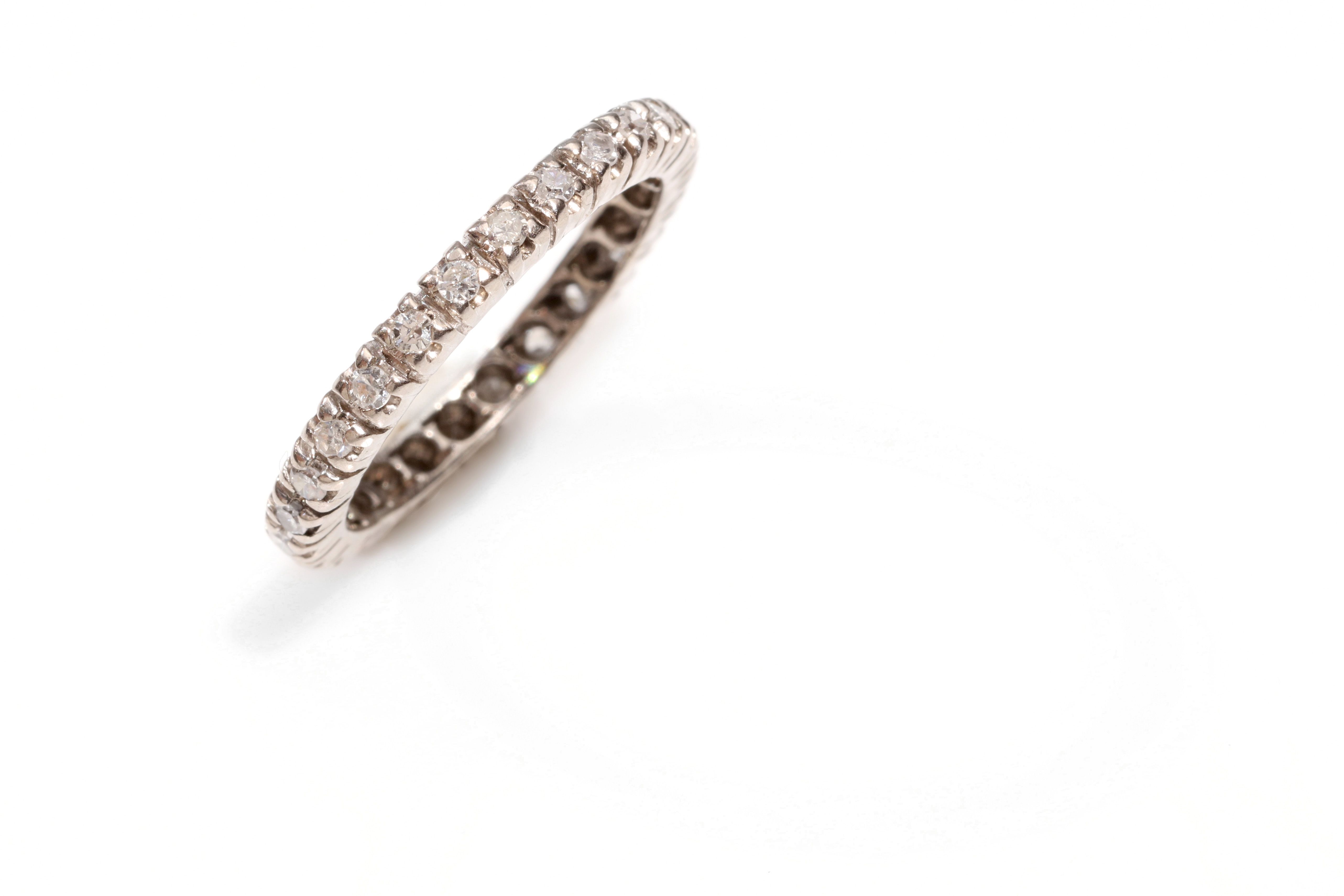 A diamond eternity ring Set throughout with single-cut diamonds, diamonds approx. 0.60ct total, ring
