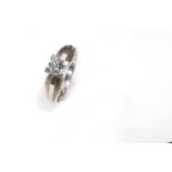 A single-stone diamond ring The brilliant-cut diamond, in a four-claw setting, diamond approx. 0.