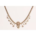 A seed pearl and diamond necklace, circa 1895 The articulated line of half seed pearls, to a central