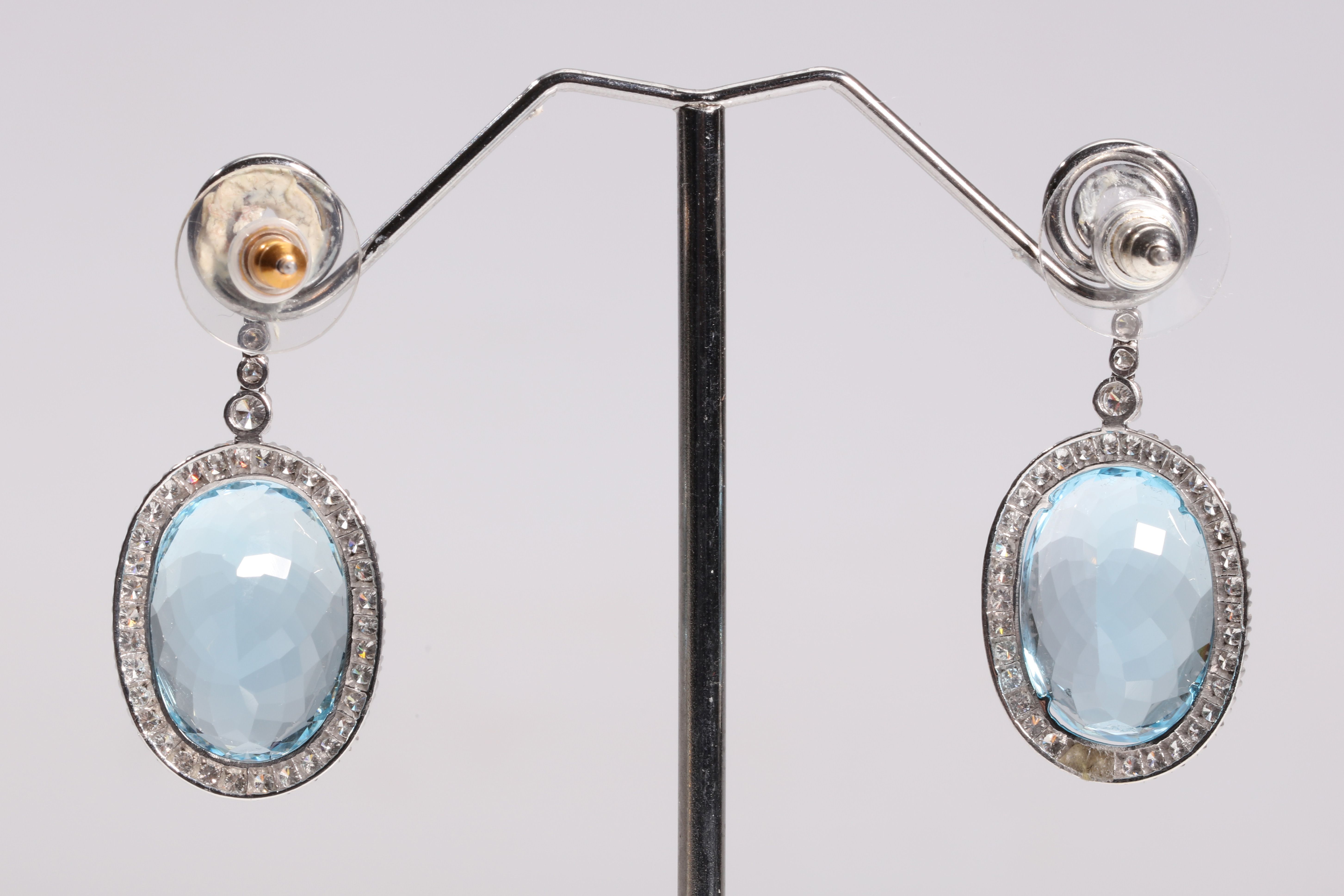 A pair of blue topaz and diamond pendent earrings Each oval-cut blue topaz within a brilliant-cut - Image 2 of 2