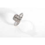 A diamond dress ring Centrally-set with baguette-cut diamonds, with brilliant-cut diamond accents,
