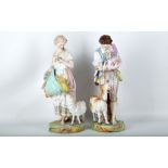 A pair of 19th Century Villeroy Boch Dresden Bisque figures of a pastoral boy and girl with sheep