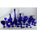 A collection of 30 items of Bristol blue glassware, to include ewers, vases, wine glasses etc (30