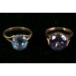A synthetic blue stone dress ring and a synthetic Alexandra dress ring (2).