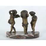 A late 19th Century bronze group (in the manner of Odion) of cavorting cherubs holding musical