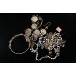 A collection of costume jewellery, including a silver curb link charm bracelet, a silver bangle, a