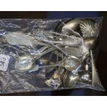 A mixed group of silver souvenir spoons and other flatware. Including examples from Jersey, Tenby