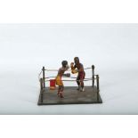 A cold painted bronze of 2 fighters in boxing ring (in the manner of Bergmaul).