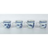 A set of four blue and white coffee cups, decorated with peonies and bamboo, 6cm high.