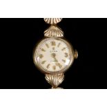 A 9ct yellow gold ladies wristwatch c.1950 by Cyma, on a scallop shell 9ct gold bracelet.