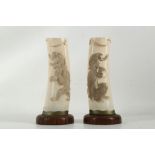 A pair of late 19th Century Japanese Meiji period ivory vases, deeply carved to both sides with