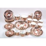 A collection of Royal Crown Derby tea ware in 'Old Imari' pattern, decorated in traditional style in