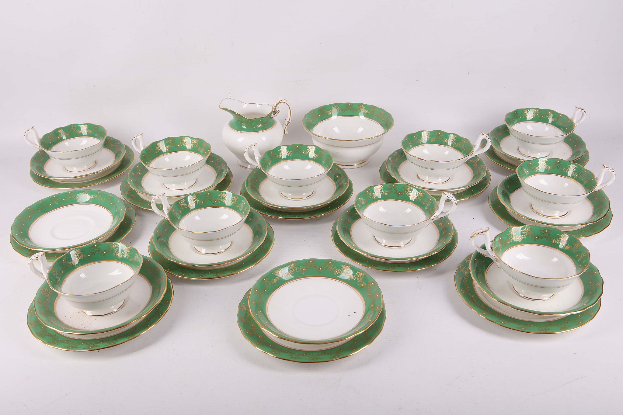 Ten early 20th Century Royal Worcester 'Maple' pattern tea cups and saucers and ten tea plates,