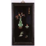 A Chinese wooden panel inlaid with jade and coral antique treasures, 28cm x 52cm.