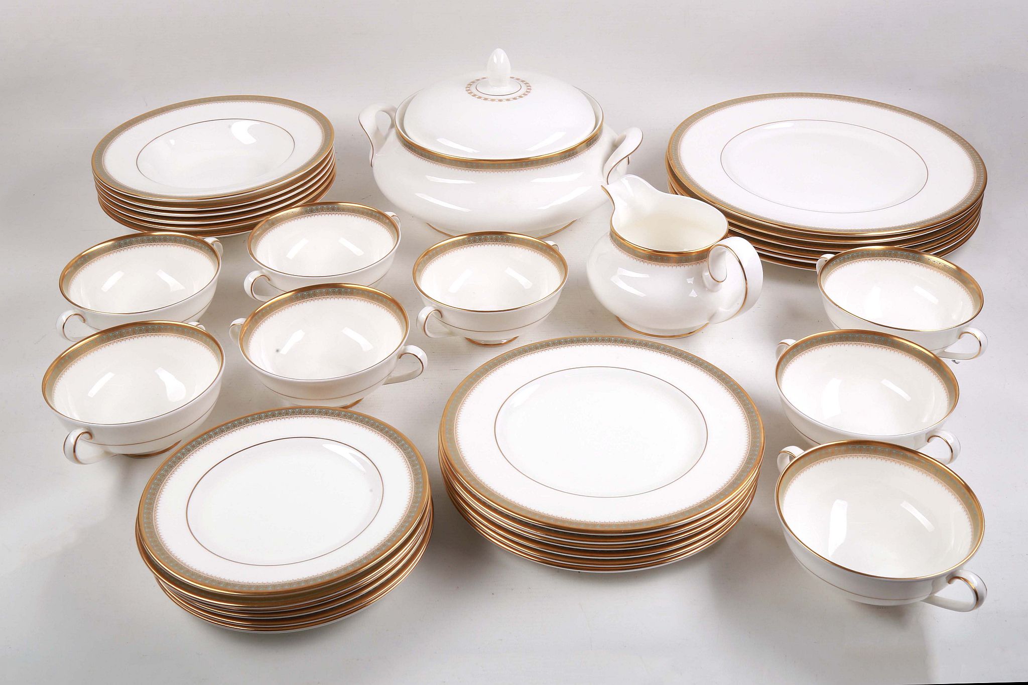 A Royal Doulton English fine bone china part dinner service for six, decorated with formal blue