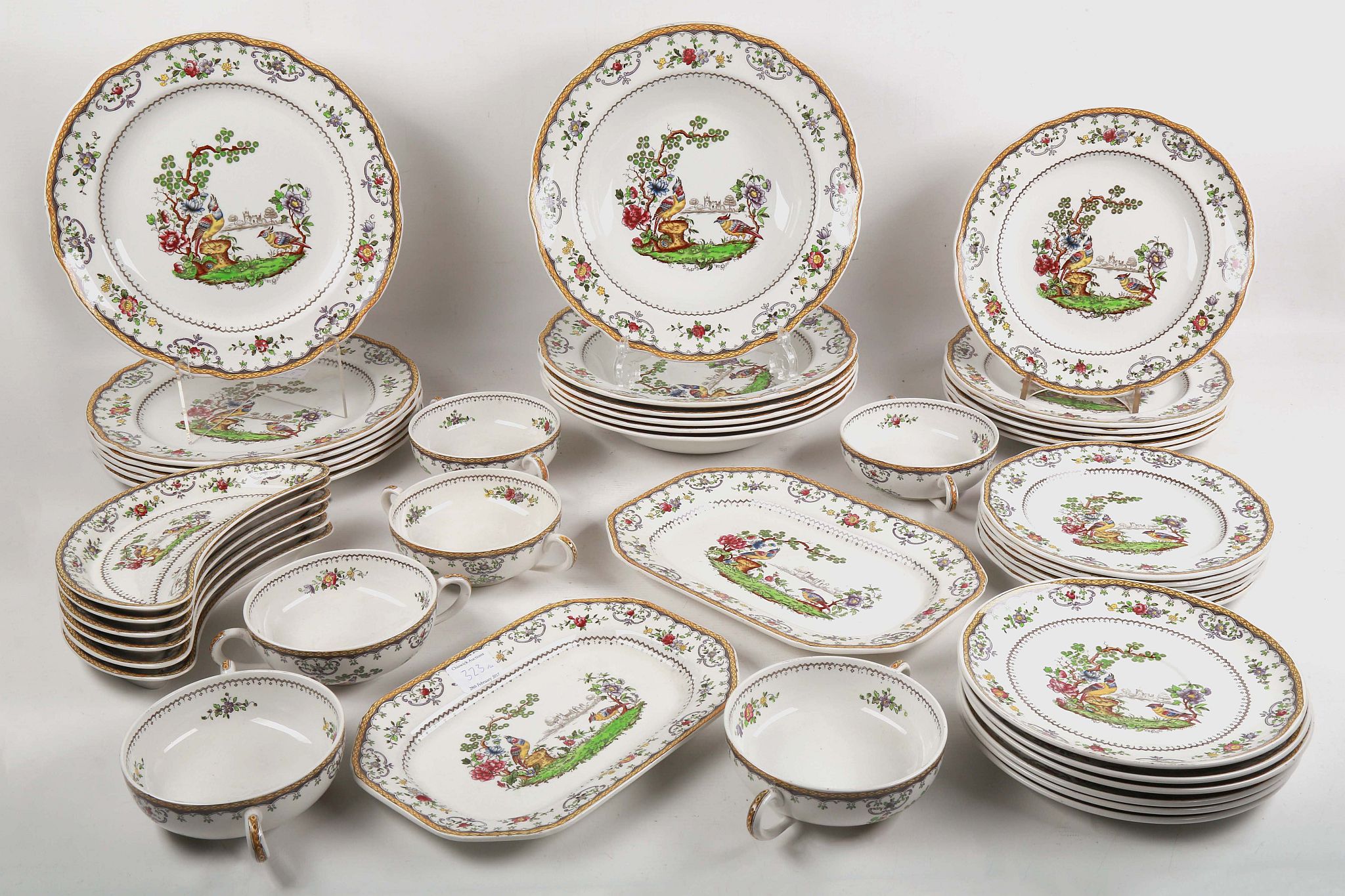 A Copeland late Spode part dinner service, printed and hand coloured with exotic birds in a