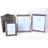 A pair of Carrs, Sheffield, silver photograph frames with beaded border; a smaller Carrs, Sheffield,