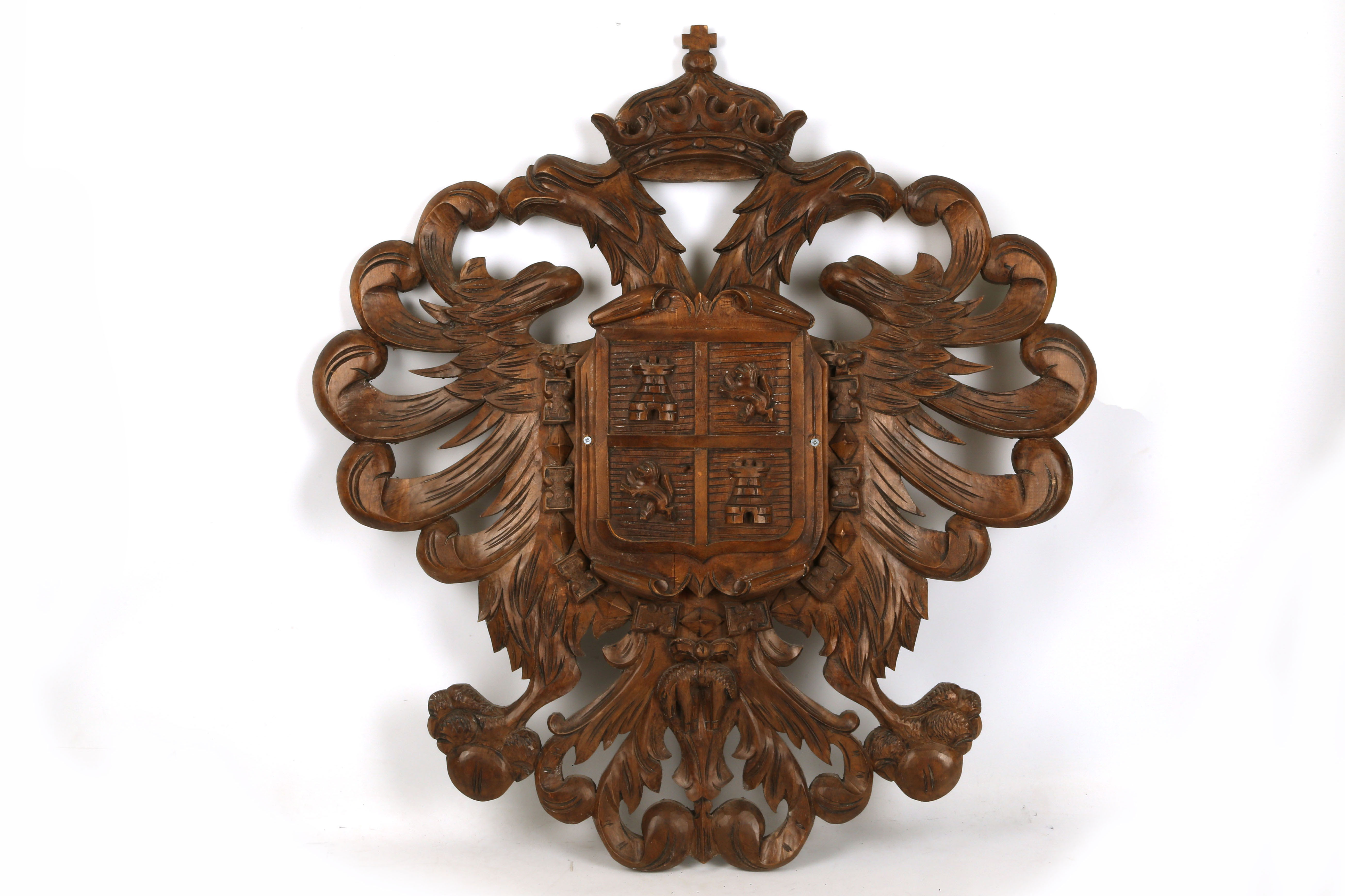 A 19th Century carved armorial chest, a double headed crowned eagle holds a carved shield with two