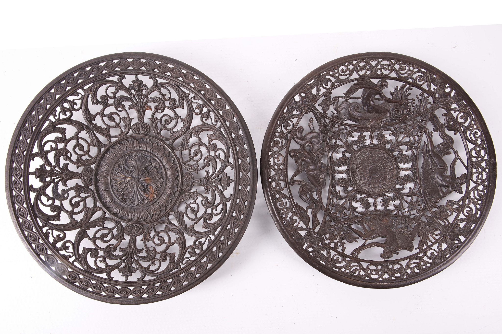 A pair of 19th Century cast iron pierced dishes with different designs (2).