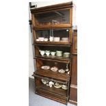 An oak Globe Wernicke five section bookcase, of typical form, with glazed doors and drawer to base.