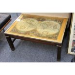 A Waring & Gillows contemporary coffee table in campaign style with a replica 17th Century world map