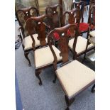 A set of 10 Victorian mahogany dining chairs (8 + 2 carvers), in George II style, having central