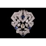 A sapphire and diamond geometric clip brooch.