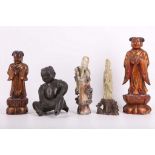 A collection of five figures, including two gilded wooden figure incense burners, two carved